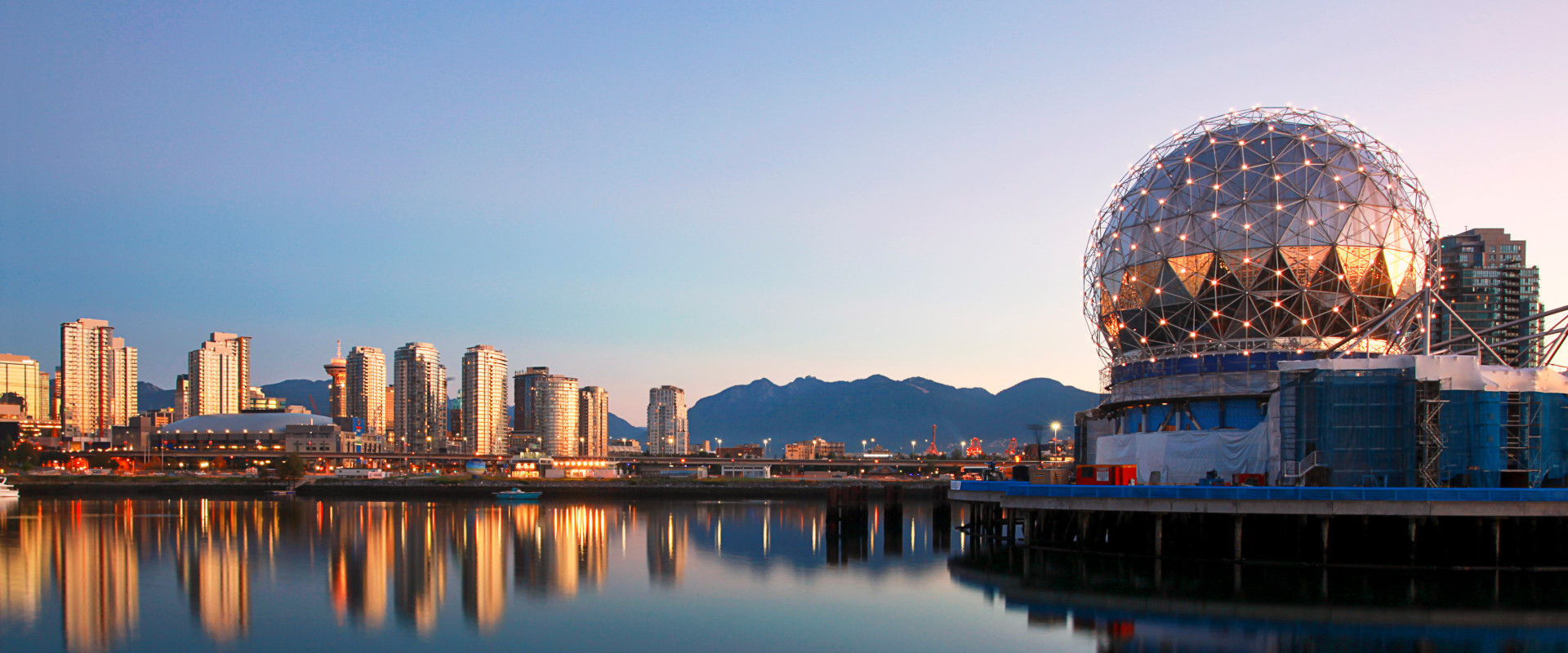 Science World in Vancouver overlooking the water with the city in the background