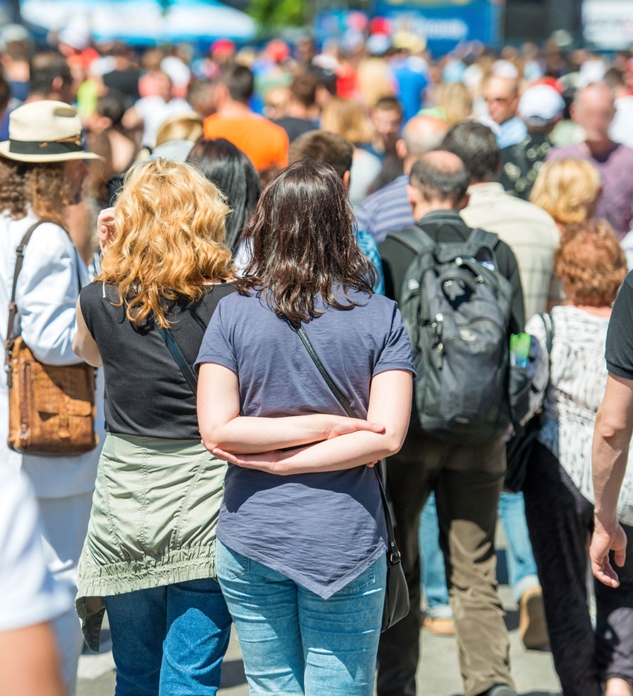 Two Woman Standing on the Crowd